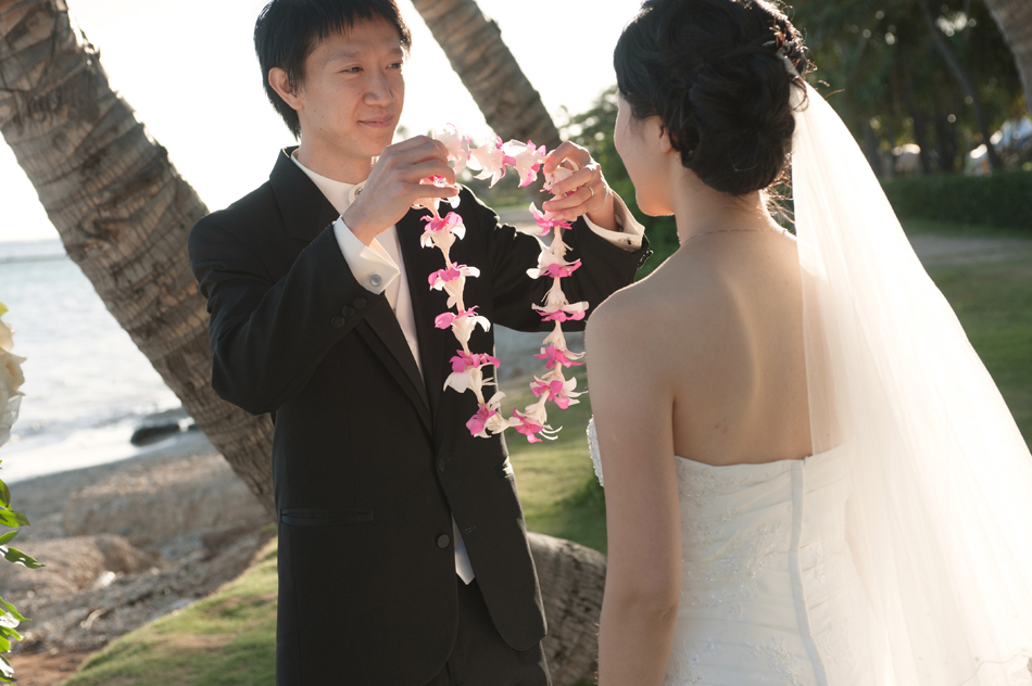 Groom gives Lei to Bride