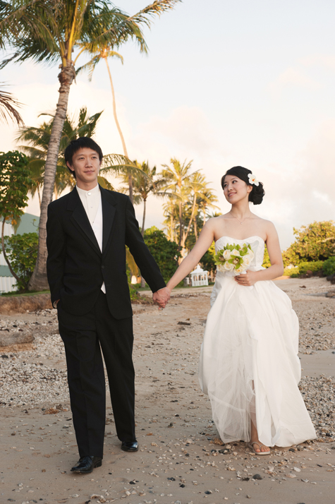 Bride and Groom walking on Kahala Beach