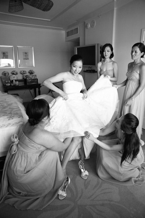 Bride getting into Vera Wang Luxe Wedding Gown