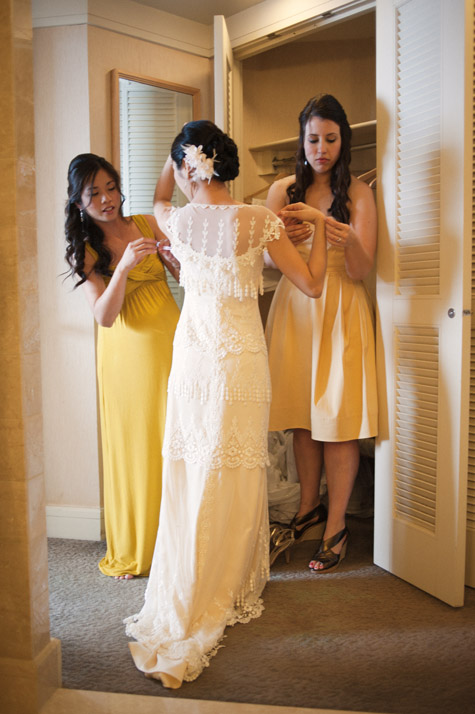 Bride Getting into Wedding Gown