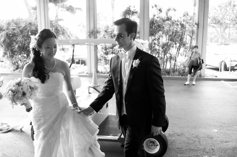 Bride and Groom arrive at Waialae Country Club on Golf Cart