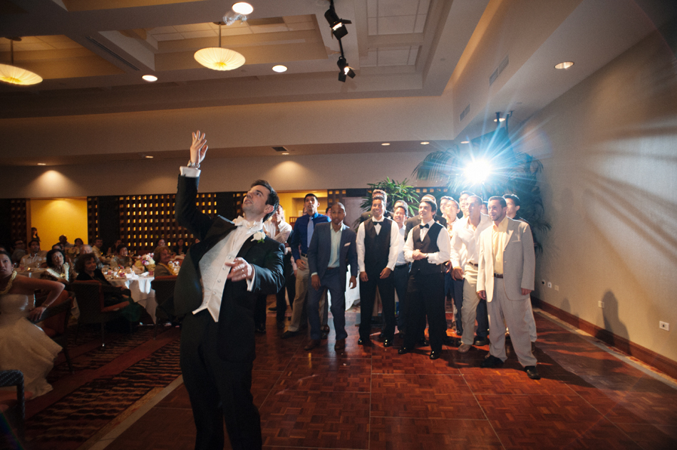 Groom Tosses Garter at Waialae Country Club Wedding Reception