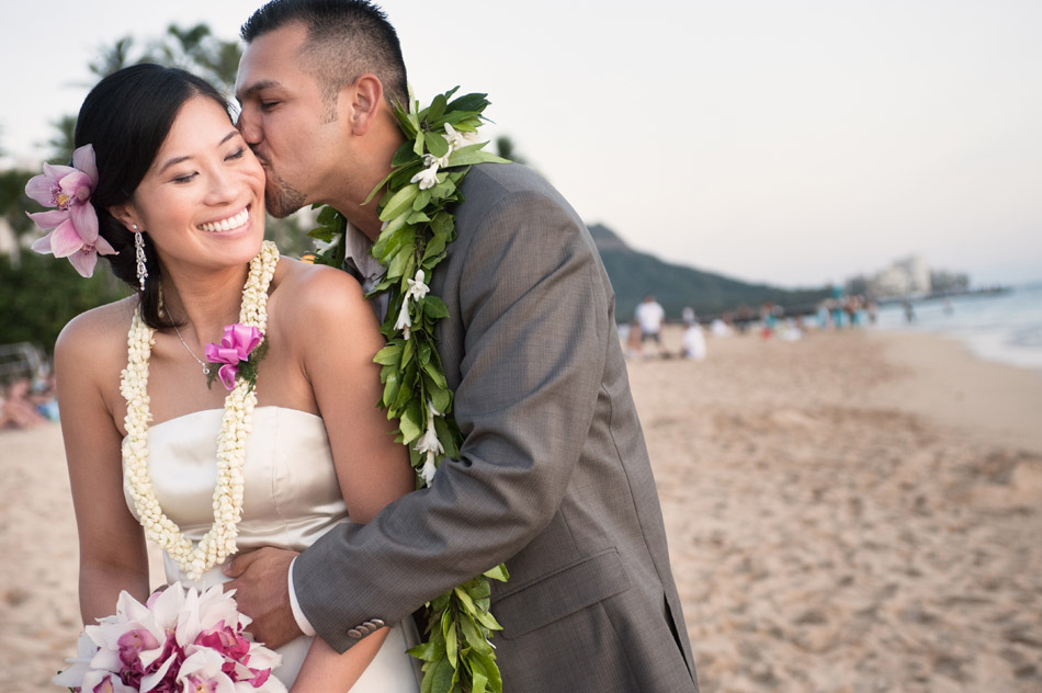 Groom kisses Bride on Waikiki Beach