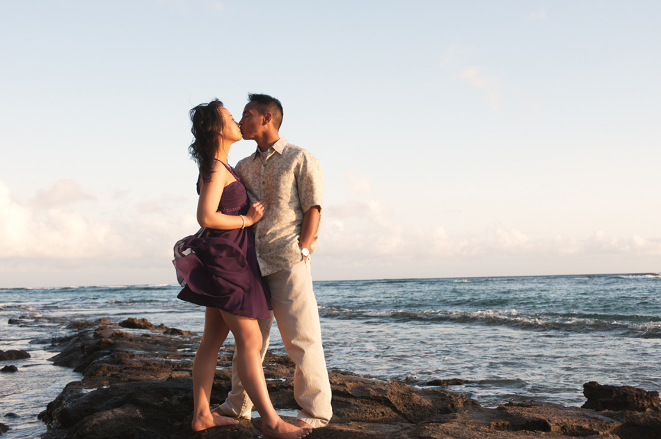 Couple embraces at beach near Waikiki