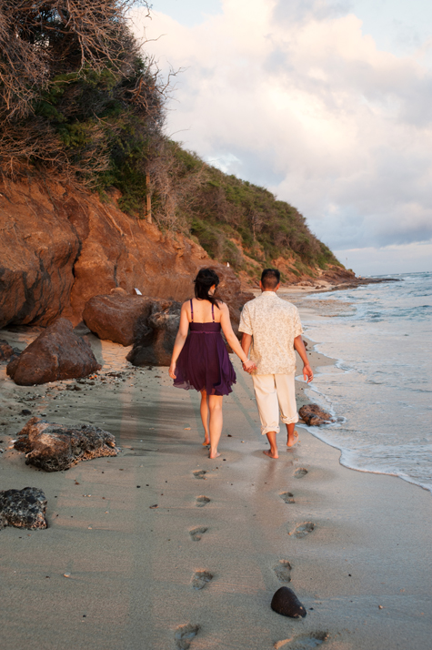 Couple walks along beach