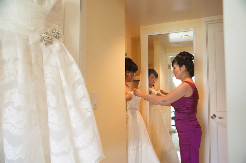 Bride and Bridesmaid with Wedding Dress