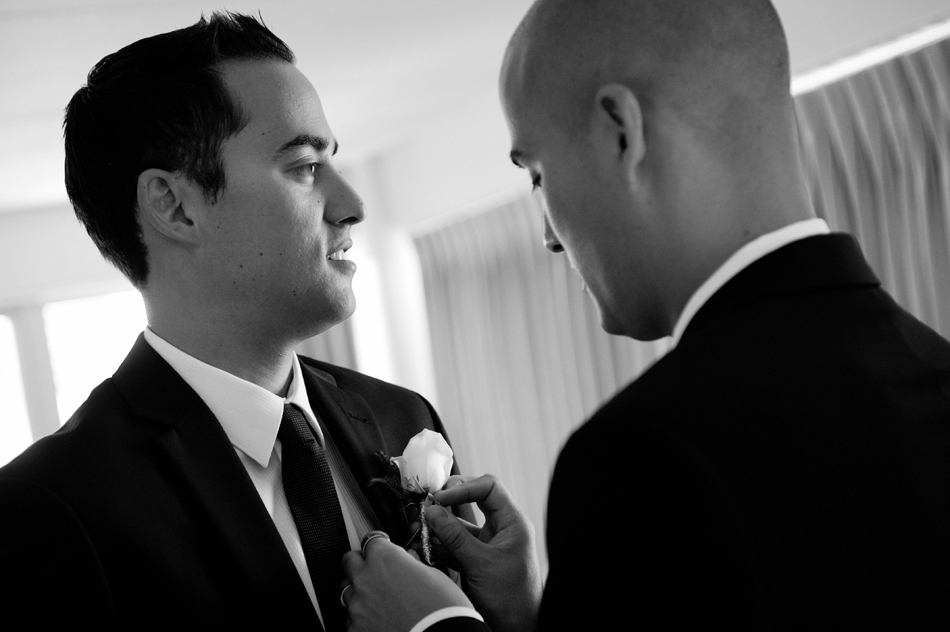 Best Man helping Groom with Boutonniere