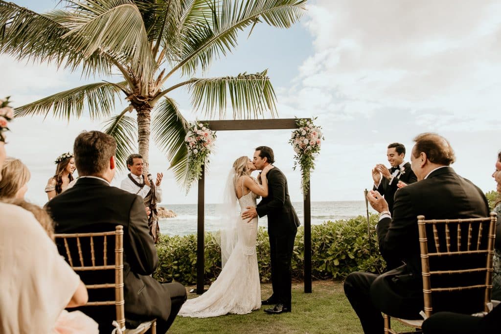 Bride and Groom Kiss at Ceremony Site at Four Seasons Resort Hawaii at Koolina