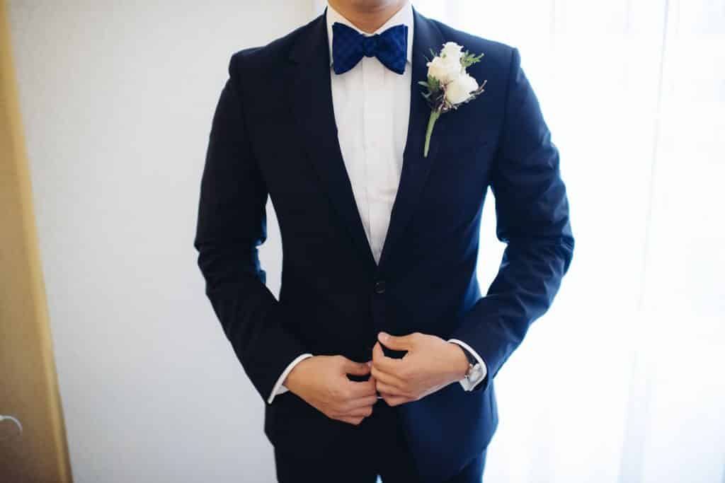 Tuxedo for Groom with white rose boutainerre