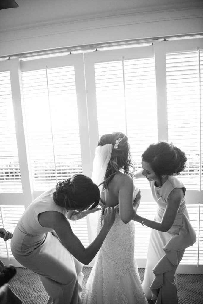 Black and White image of bride getting ready