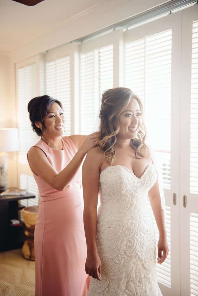 Color image of maid of honor with bride