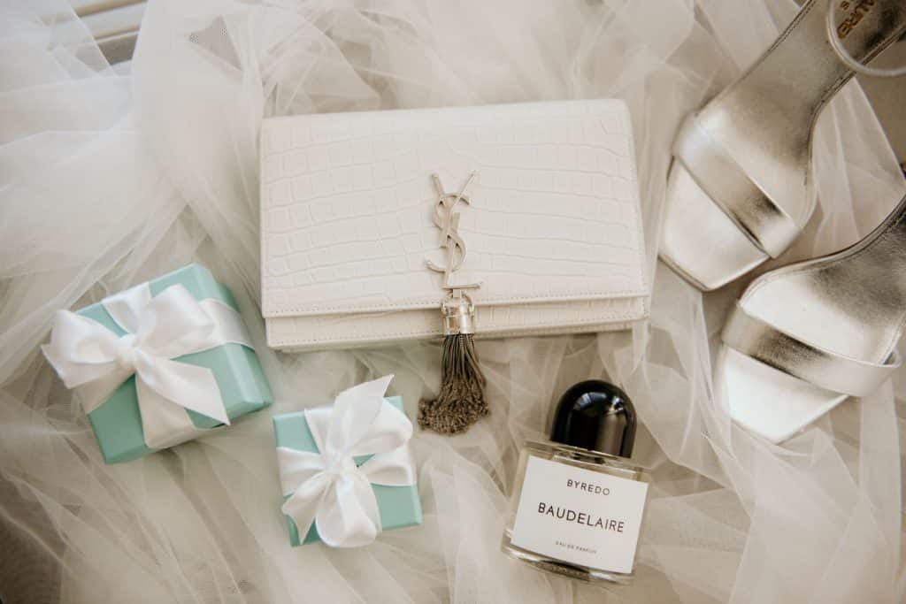 Wedding day details including Tiffany Ring Box, YSL clutch, Baudelaire