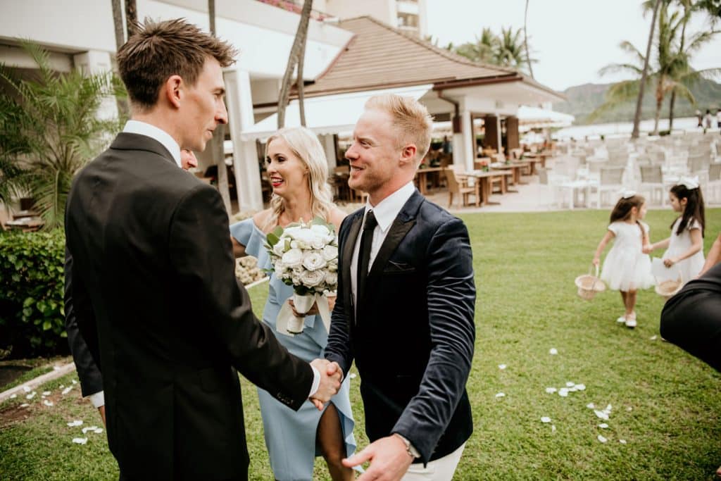 Wedding Guest Congratulating Groom by Shaking Hand