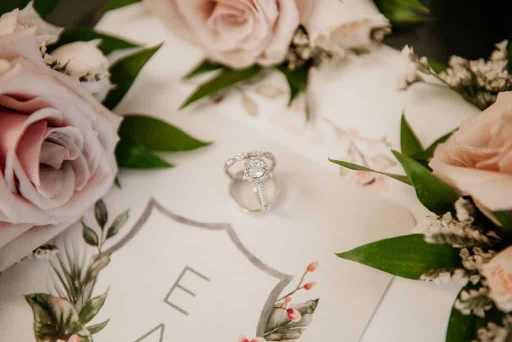 Cushion Cut Engagement Ring with Wedding Bands on Wedding Invitation