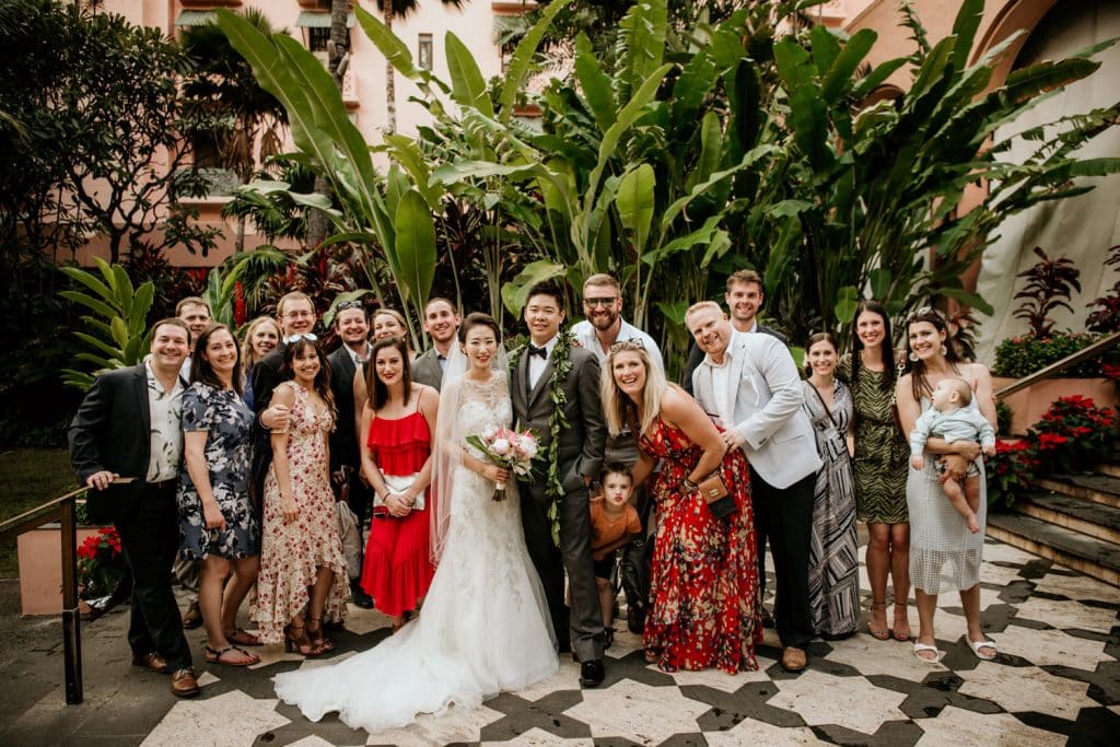 Friends of Bride & Groom pose with couple at Royal Hawaiian
