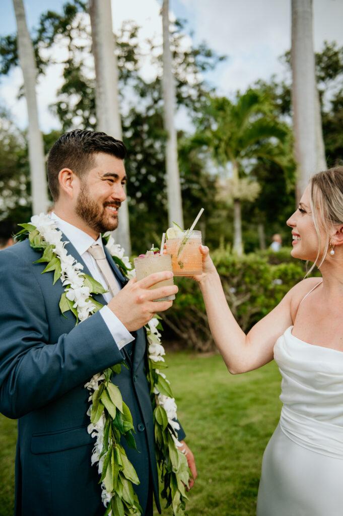 Bride and Groom toasting each other with tropical drinks from Stir Beverage