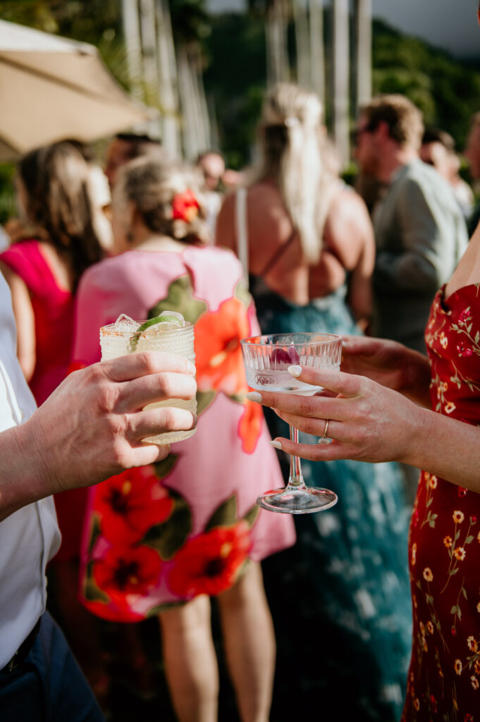 Wedding guests toasting each other with drinks from Stir Beverage Hawaii.