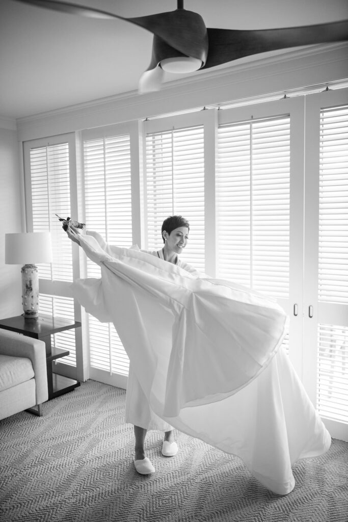 Black and White image of bride with her wedding dress.