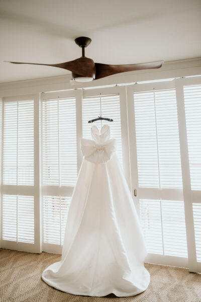 Luxury Wedding Dress hanging in Four Seasons Hotel Suite