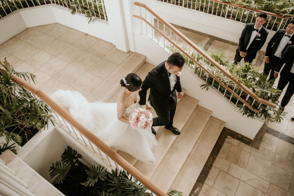 Bride and Groom walking down steps