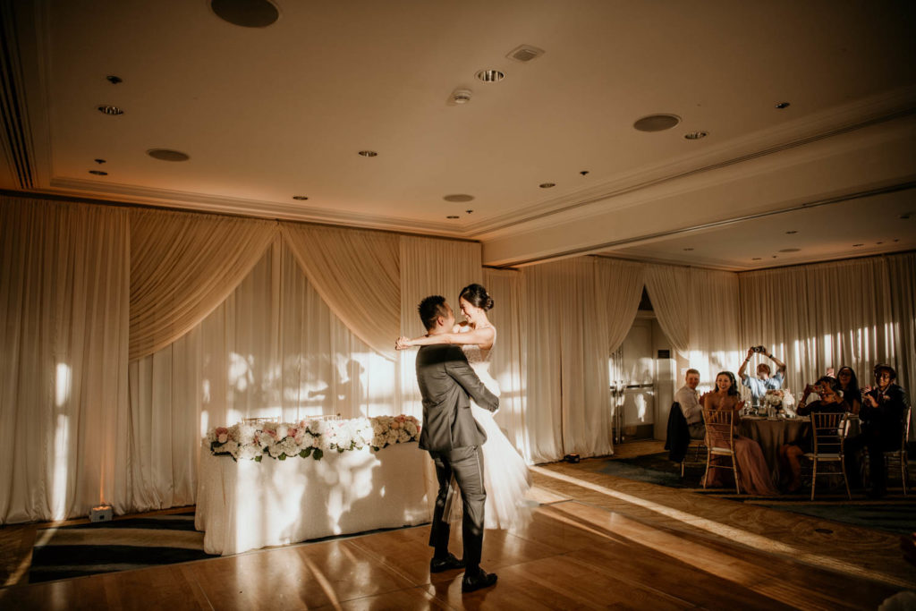 Groom carrying bride during first dance at Lurline Room