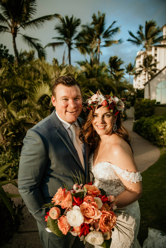 Groom and Bride portrait in front of Four Seasons Resort Oahu at Koolina.