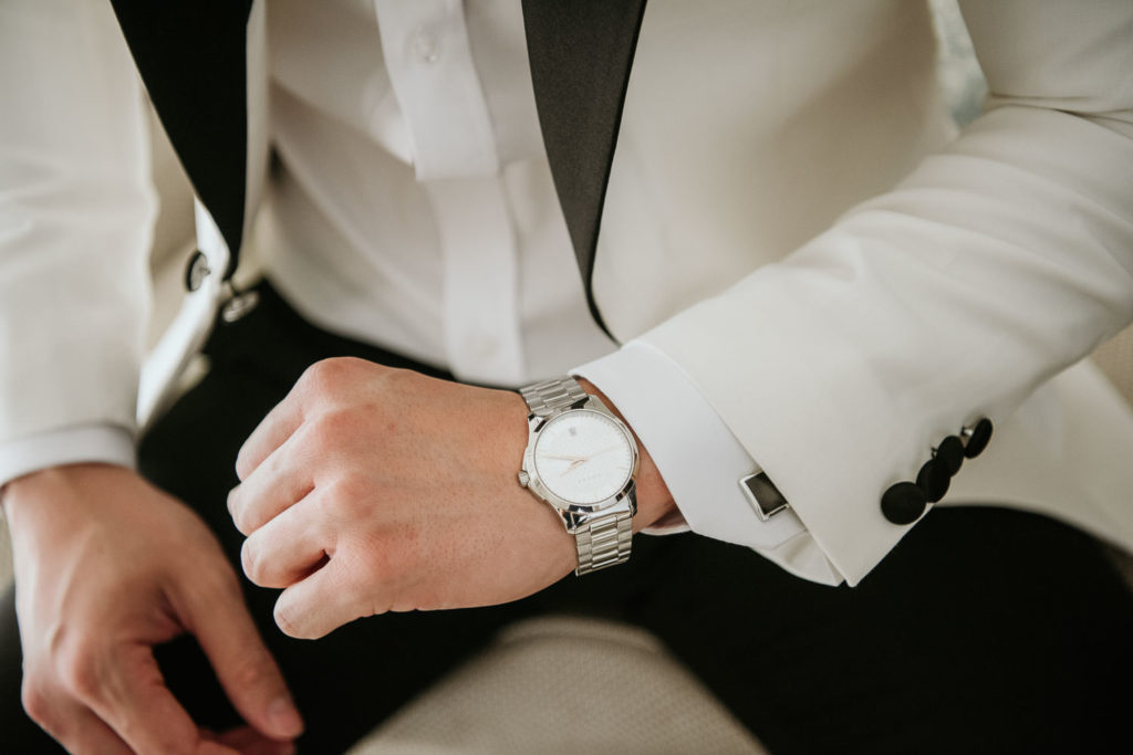 Groom wearing Rolex Watch