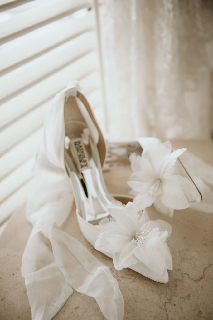 Badgley Mishka white bridal shoes at Halekulani Hotel