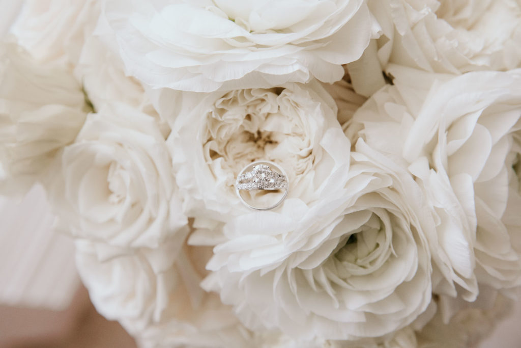 Engagement Ring and Wedding Band photographed in white roses