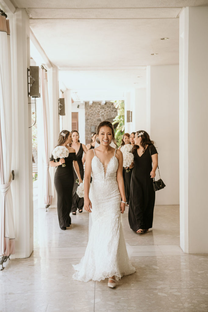 Bride walking down hallway of Halekulani Hotel