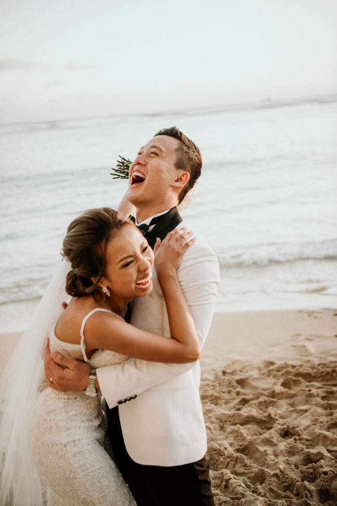 A fun candid moment captured by Derek Wong Photography, Hawaii's Top Wedding Photographer