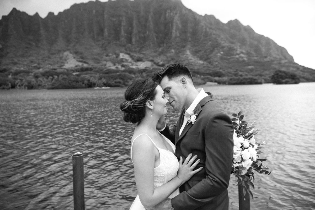 Bride and Groom kissing on Secret Island Dock