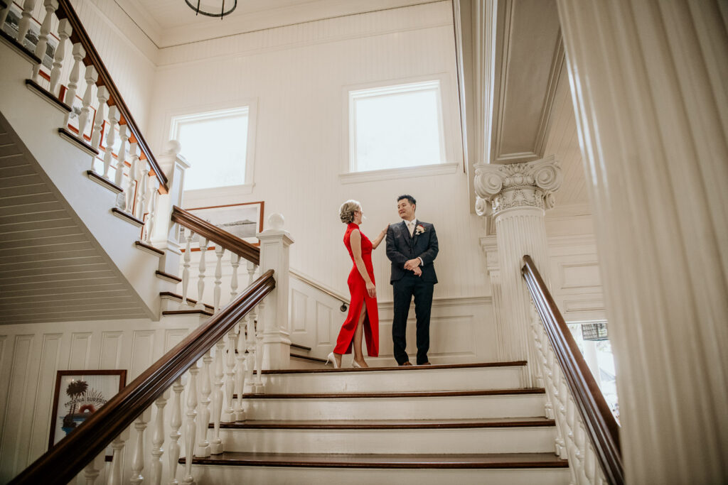 Bride and Groom first look on grand staircase at the Moana Surfrider.