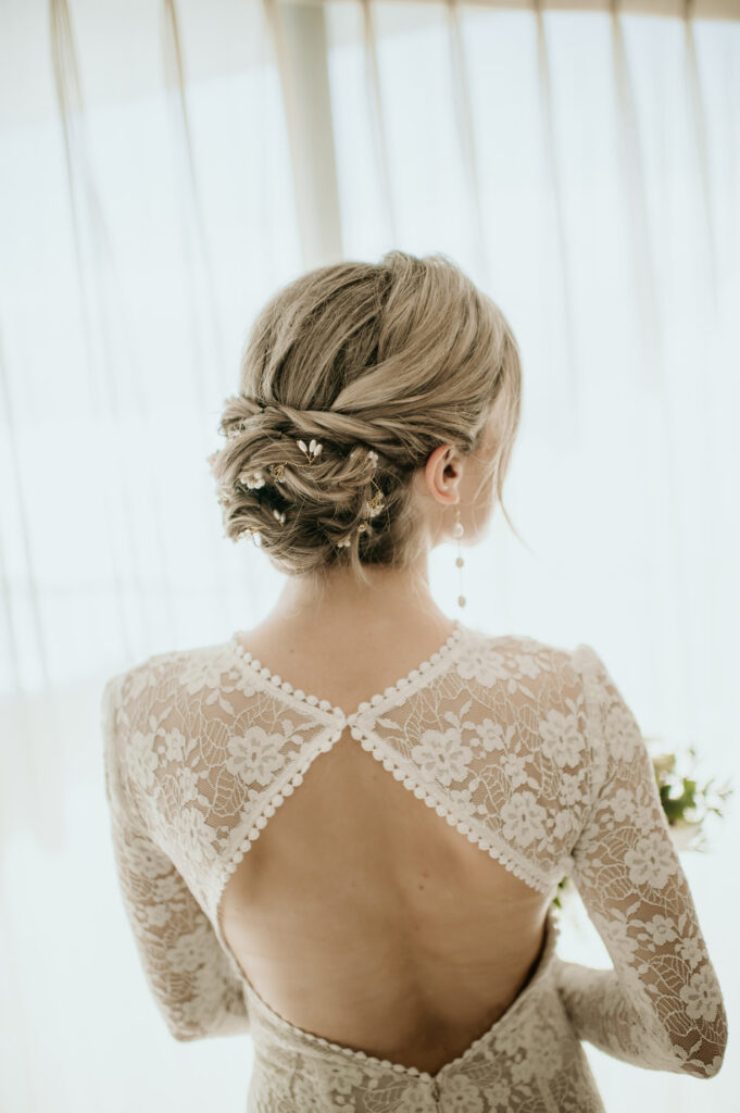 Back of hair and wedding dress.