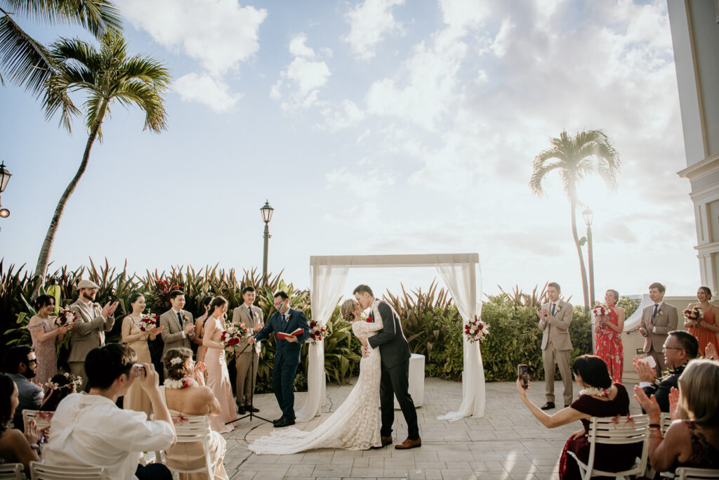 The kiss at the wedding ceremony at the Moana Surfrider's Diamond Head Lawn.
