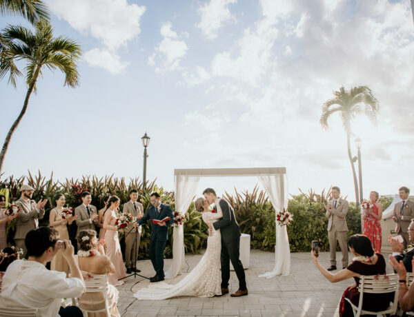 The kiss at the wedding ceremony at the Moana Surfrider's Diamond Head Lawn.