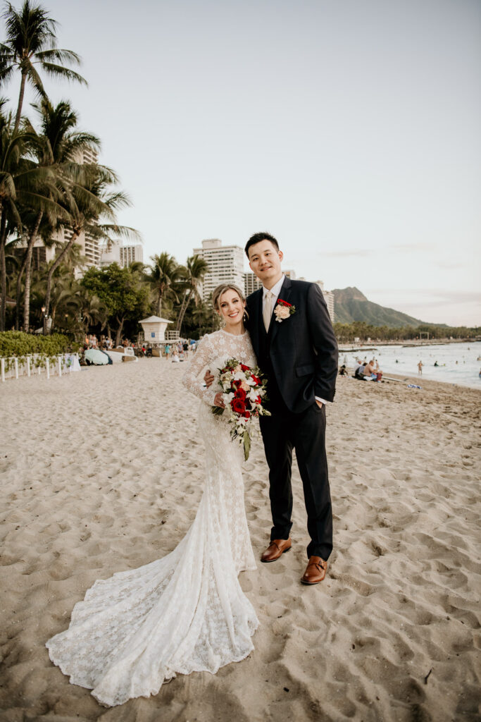 Bride and Groom portraits on Waikiki Beach at Sunset in front of the Moana Surfrider.