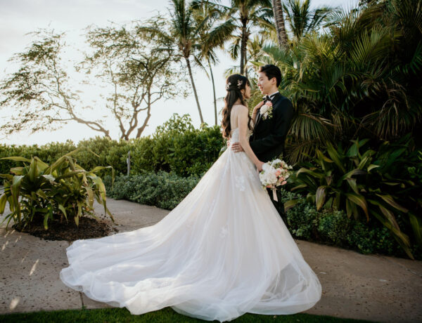Bride and Groom moment at the Four Seasons Ocean Lawn with wedding dress.